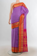 Pure Silk Pure Zari Lavender Kanjivaram Saree with Zari Butta on the body and Silk Border.  displayed on a mannequin
