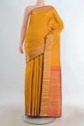 Pure Silk Pure Zari Mustard Kanjivaram Saree with Zari Butta on the body and Silk Border.  displayed on a mannequin