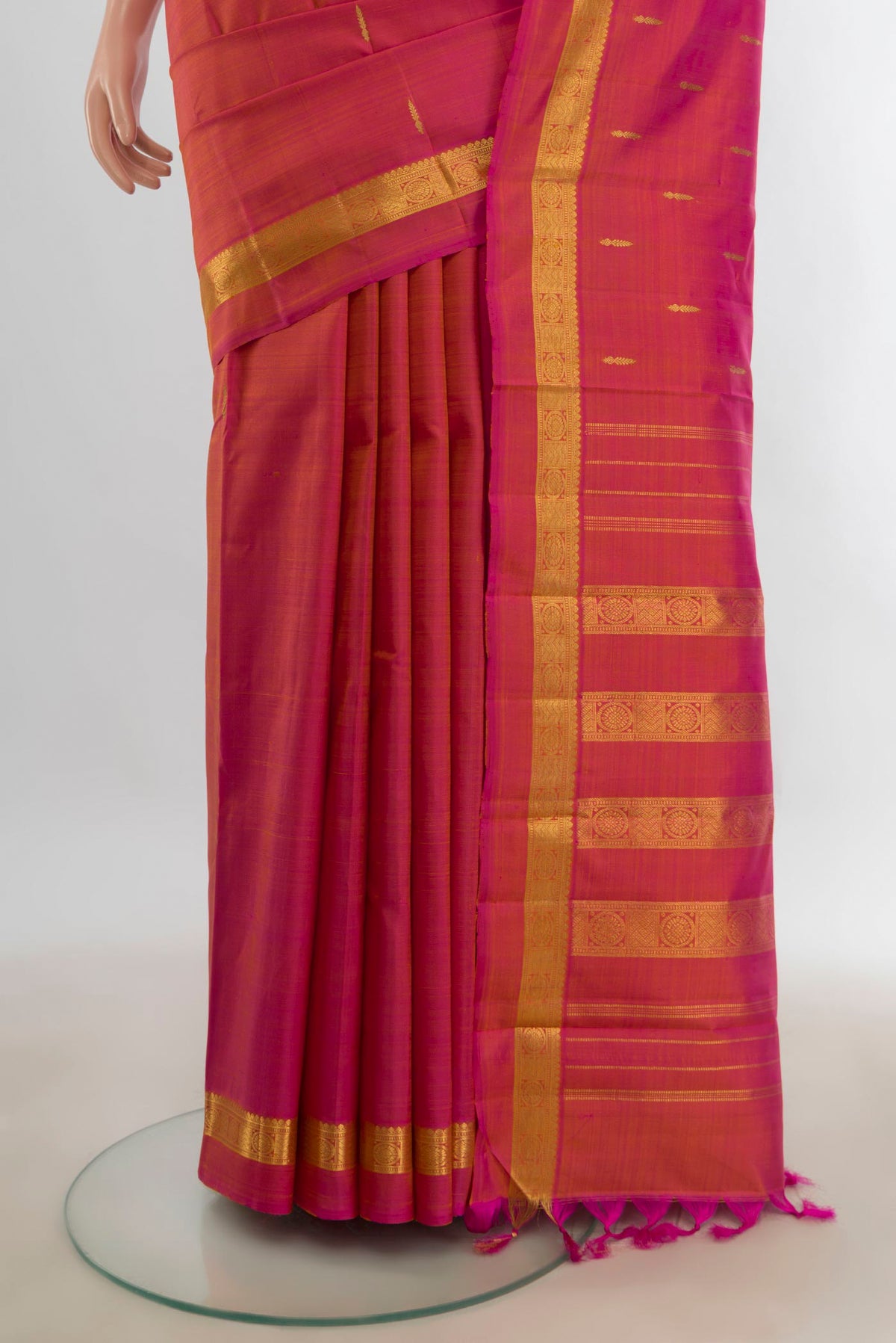 Pleats and pallu of Pure Silk Pure Zari Peach Kanjivaram Saree with Zari Butta on the body and Silk Border. 