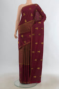 Pure Silk Maroon Kanjivaram Saree with Zari Butta on the body and Plain Border.  displayed on a mannequin