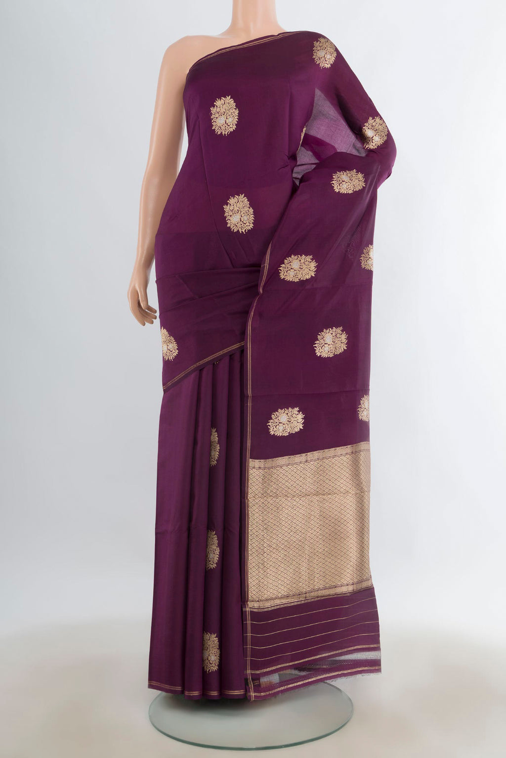 Pure Silk Purple Banarasi Katan Saree with Zari Butta on the body and Zari Border.  displayed on a mannequin