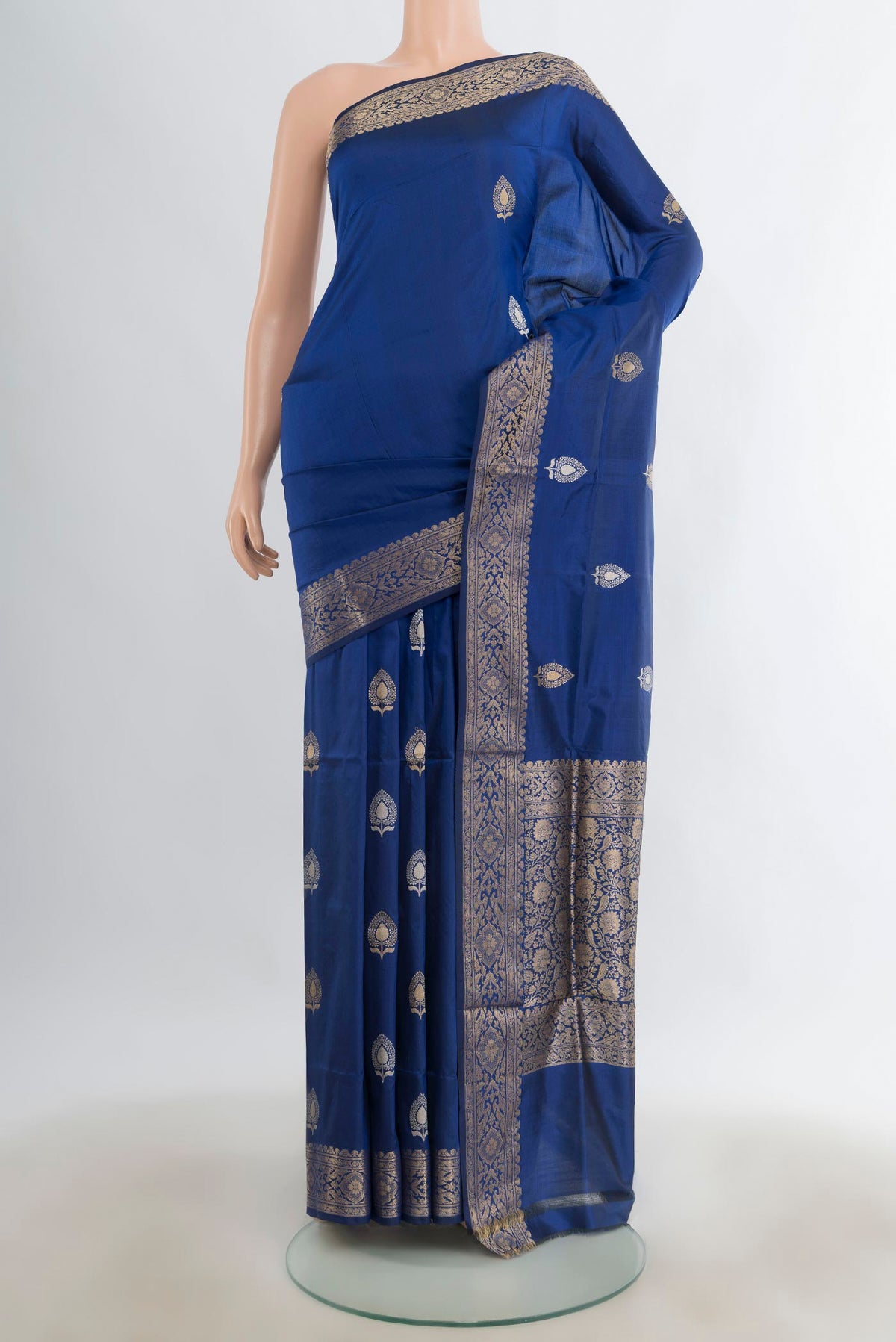 Pure Silk Blue Banarasi Katan Saree with Zari Butta on the body and Zari Border.  displayed on a mannequin