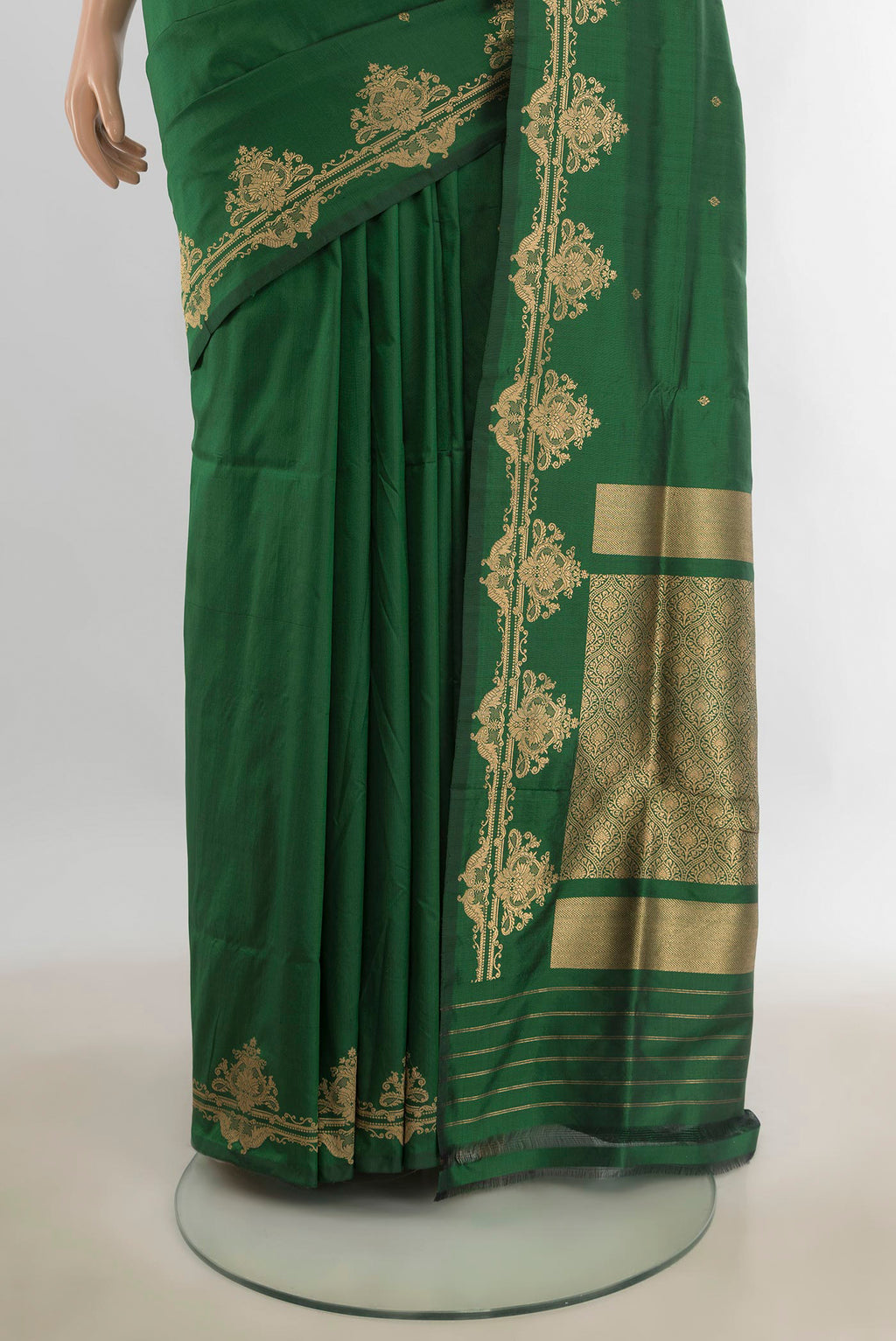 Pleats and pallu of Pure Silk Bottle Green Banarasi Katan Saree with Zari Butta on the body and Silk Border. 