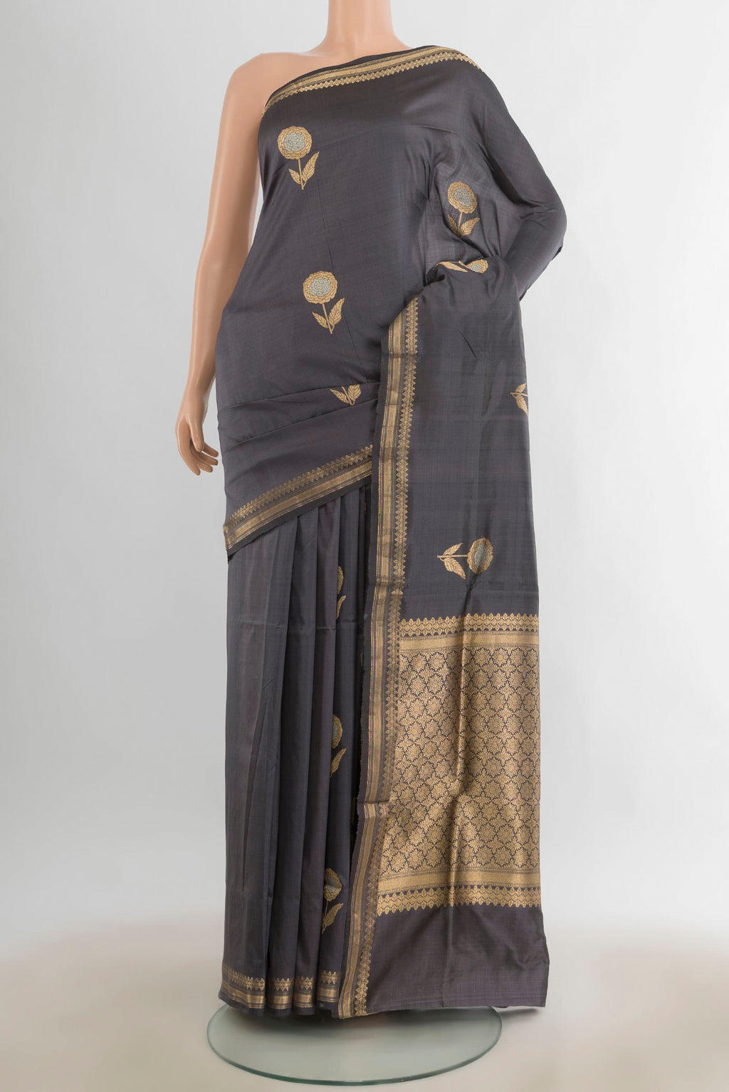 Pure Silk Davys Grey Banarasi Katan Saree with Zari Butta on the body and Silk Border.  displayed on a mannequin