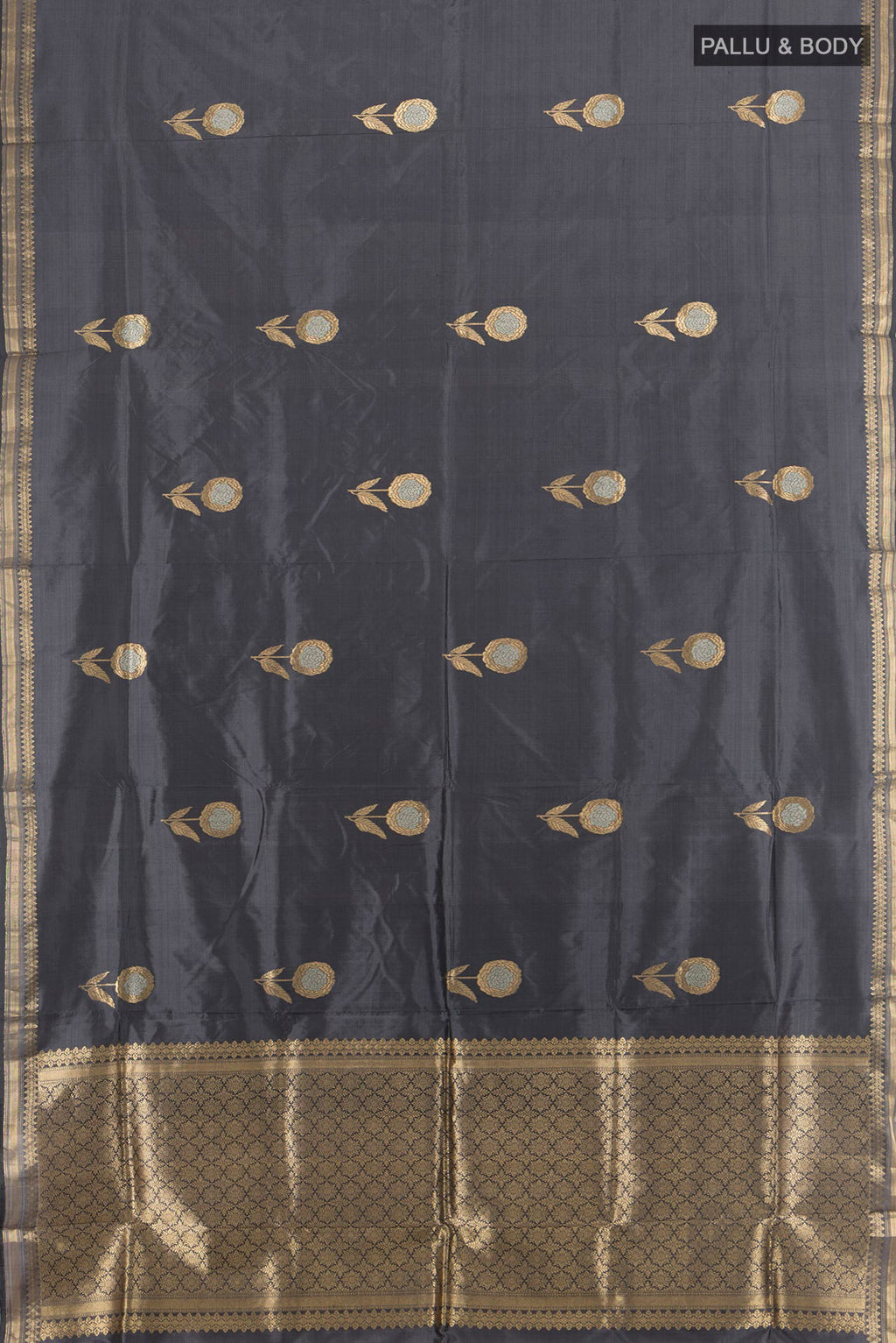 Flat view of Pure Silk Davys Grey Banarasi Katan Saree with Zari Butta on the body and Silk Border. 