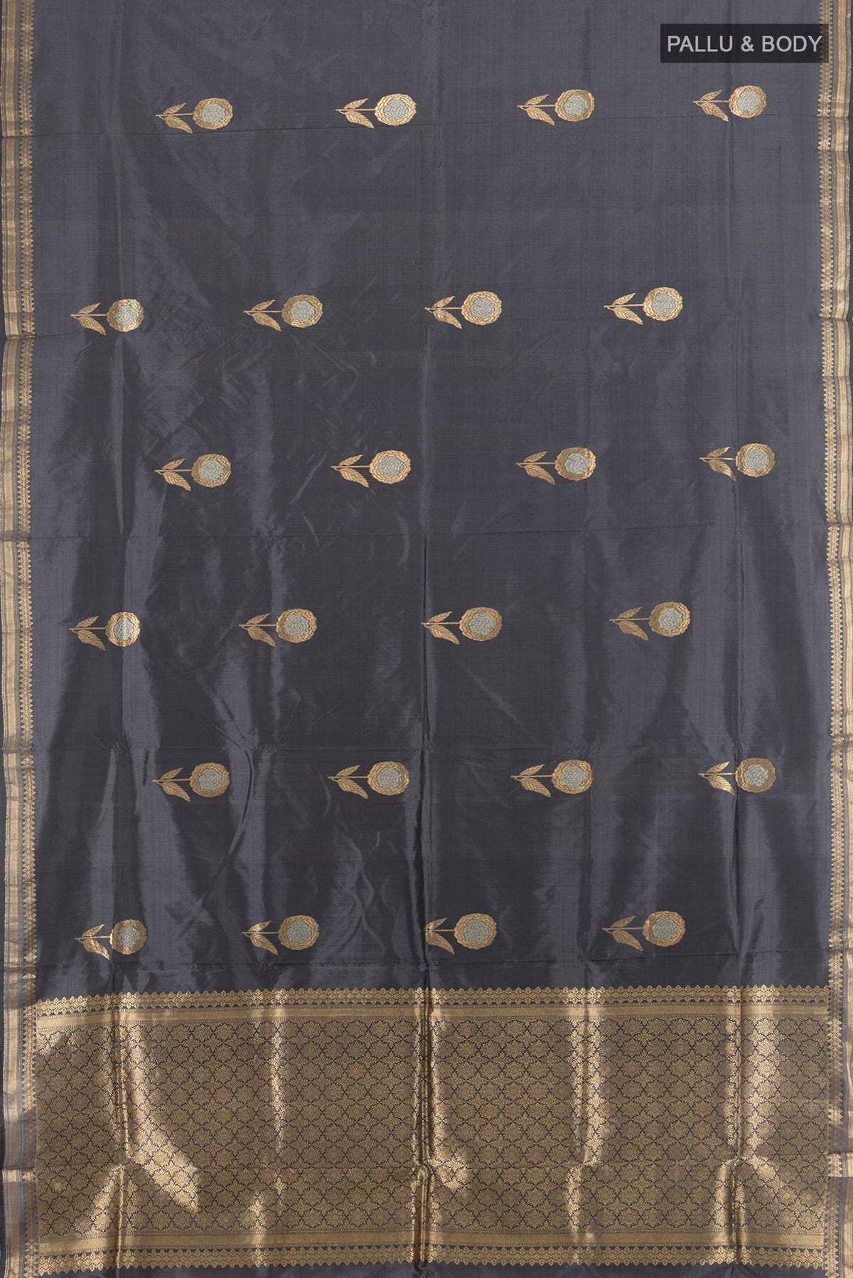 Flat view of Pure Silk Davys Grey Banarasi Katan Saree with Zari Butta on the body and Silk Border. 