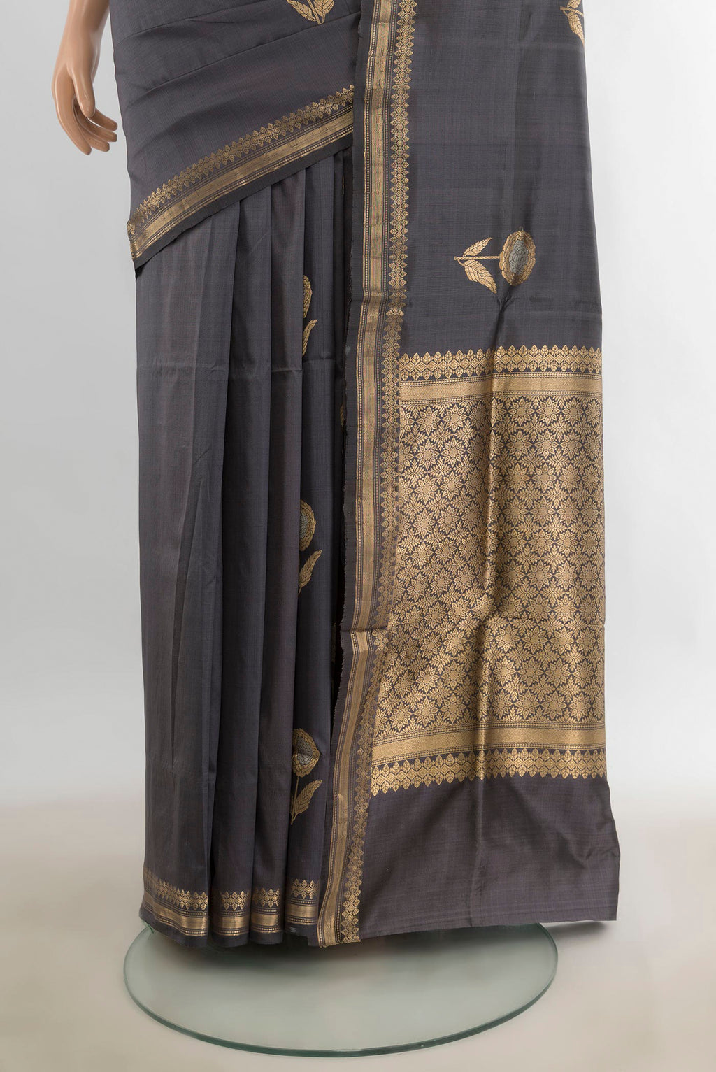 Pleats and pallu of Pure Silk Davys Grey Banarasi Katan Saree with Zari Butta on the body and Silk Border. 