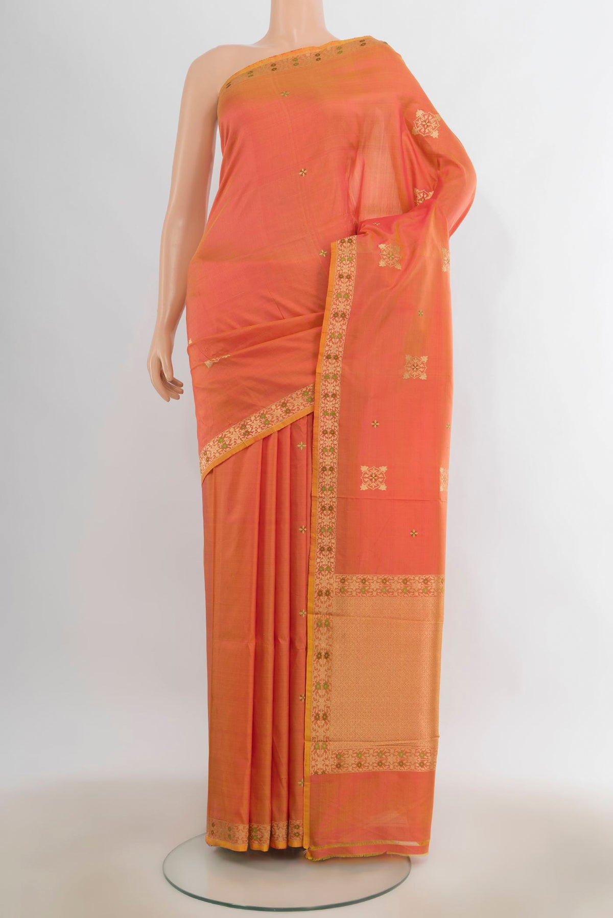 Pure Silk Peach Banarasi Katan Saree with Zari Butta on the body and Zari Border.  displayed on a mannequin