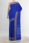 Pure Silk Multi Color Pochampally Saree with Ikat Print on the body and Silk Border.  displayed on a mannequin