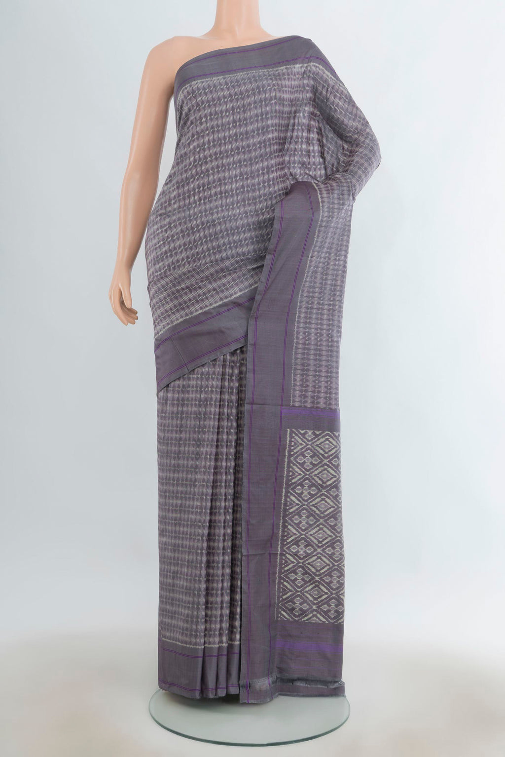 Pure Silk Grey Pochampally Saree with Pure Ikat on the body and Plain Border.  displayed on a mannequin