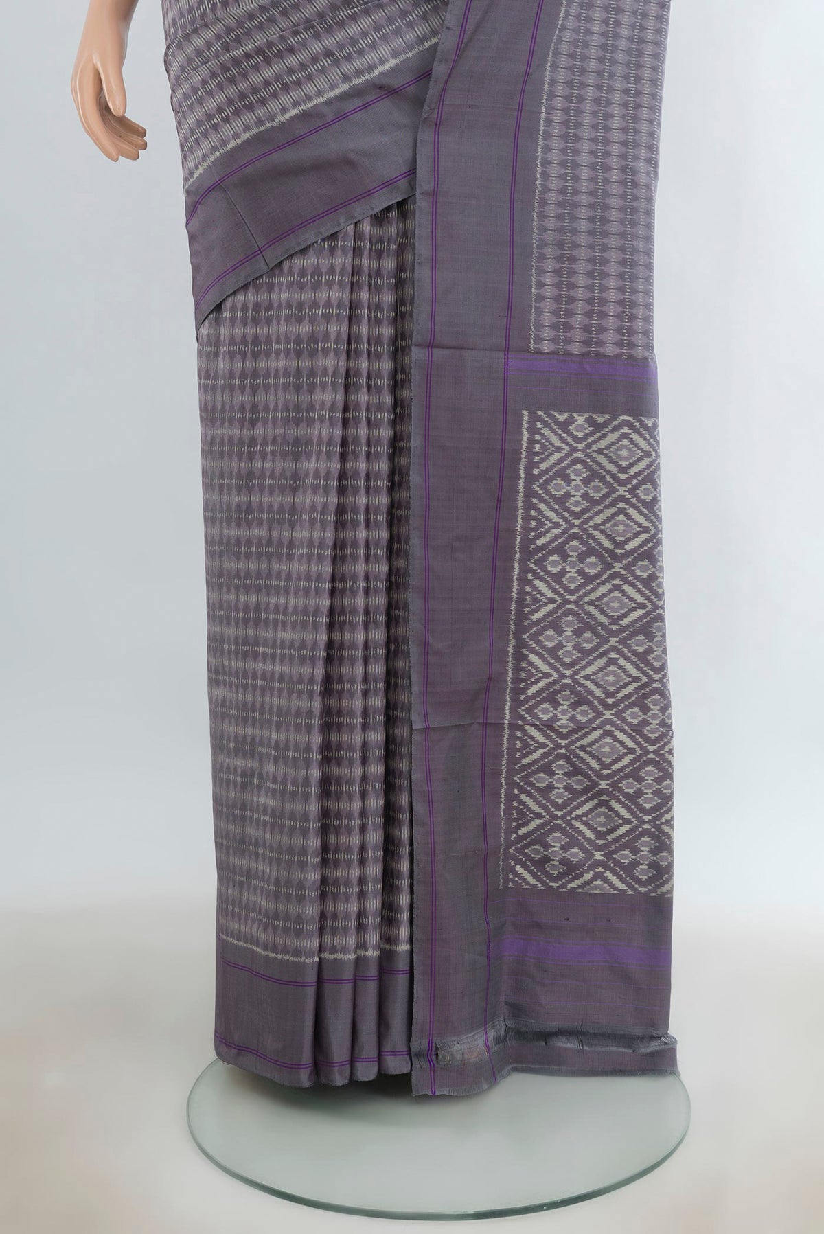 Pleats and pallu of Pure Silk Grey Pochampally Saree with Pure Ikat on the body and Plain Border. 