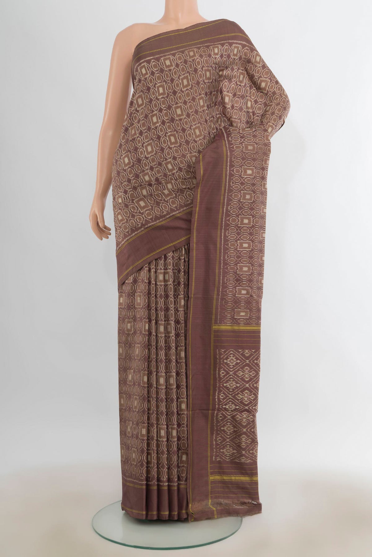 Pure Silk Brown Pochampally Saree with Pure Ikat on the body and Plain Border.  displayed on a mannequin