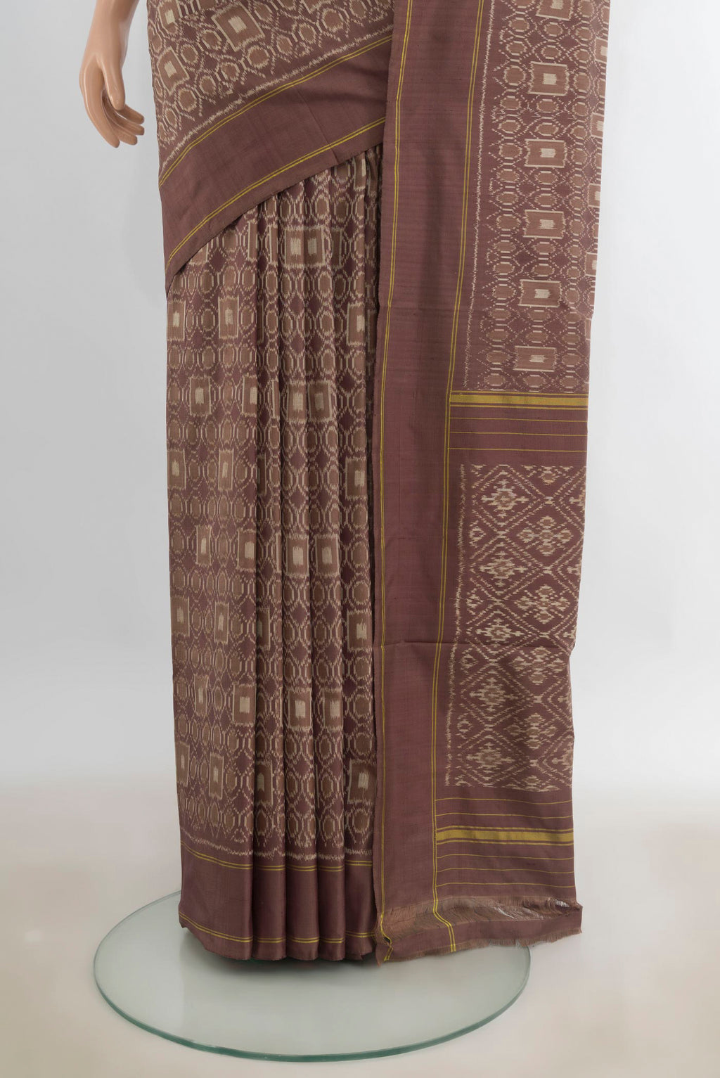 Pleats and pallu of Pure Silk Brown Pochampally Saree with Pure Ikat on the body and Plain Border. 