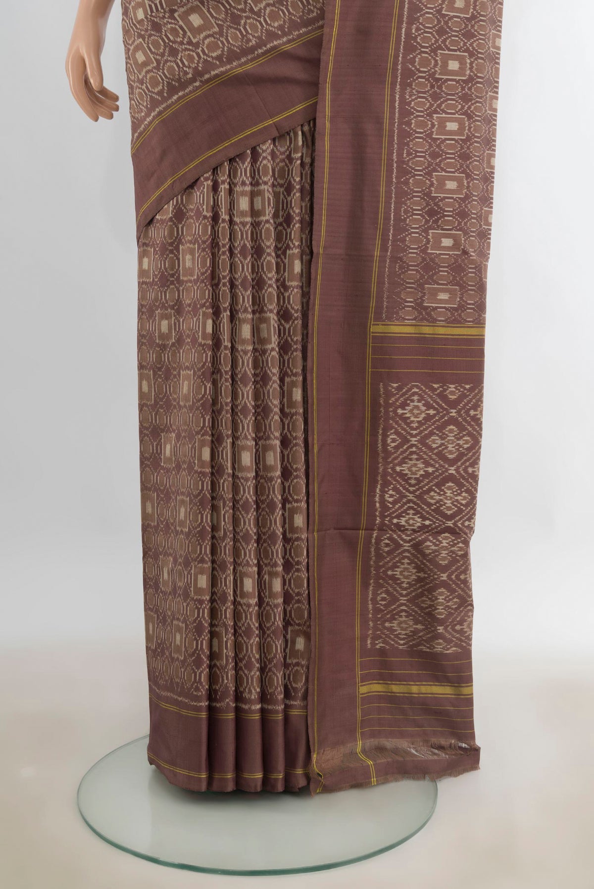 Pleats and pallu of Pure Silk Brown Pochampally Saree with Pure Ikat on the body and Plain Border. 