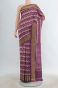 Pure Silk Lavender Pochampally Saree with Pure Ikat on the body and Zari Border.  displayed on a mannequin