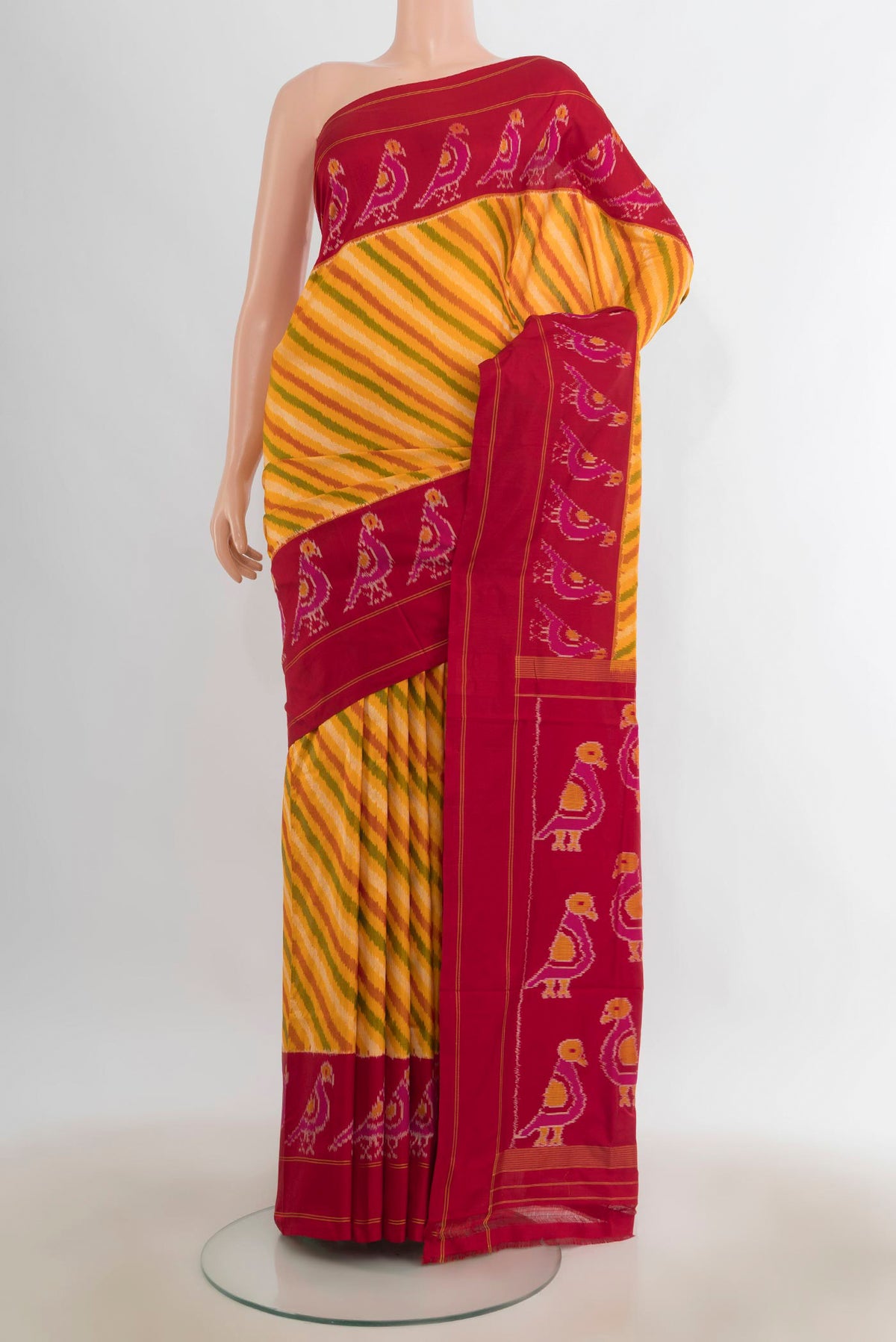 Pure Silk Yellow Pochampally Saree with Pure Ikat on the body and Ikat Border.  displayed on a mannequin