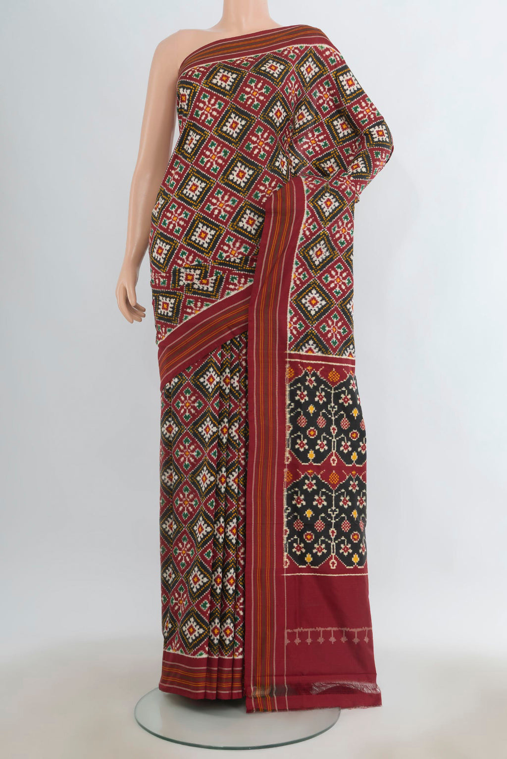 Pure Silk Multi Color Double Ikat Saree with Pure Ikat on the body and Plain Border.  displayed on a mannequin