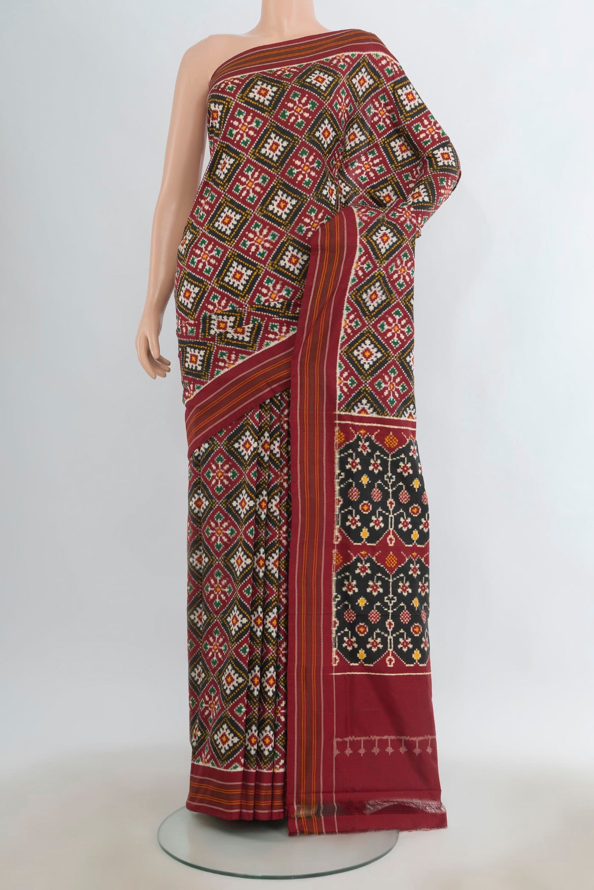 Pure Silk Multi Color Double Ikat Saree with Pure Ikat on the body and Plain Border.  displayed on a mannequin