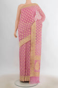 Pure Silk Rose pink Banarasi Saree with Zari Butta on the body and Zari Border.  displayed on a mannequin