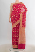 Pure Silk Dark Pink Banarasi Saree with Zari Butta on the body and Zari Border.  displayed on a mannequin
