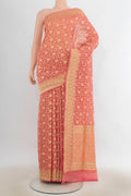 Pure Silk Peach Banarasi Saree with Zari Butta on the body and Zari Border.  displayed on a mannequin