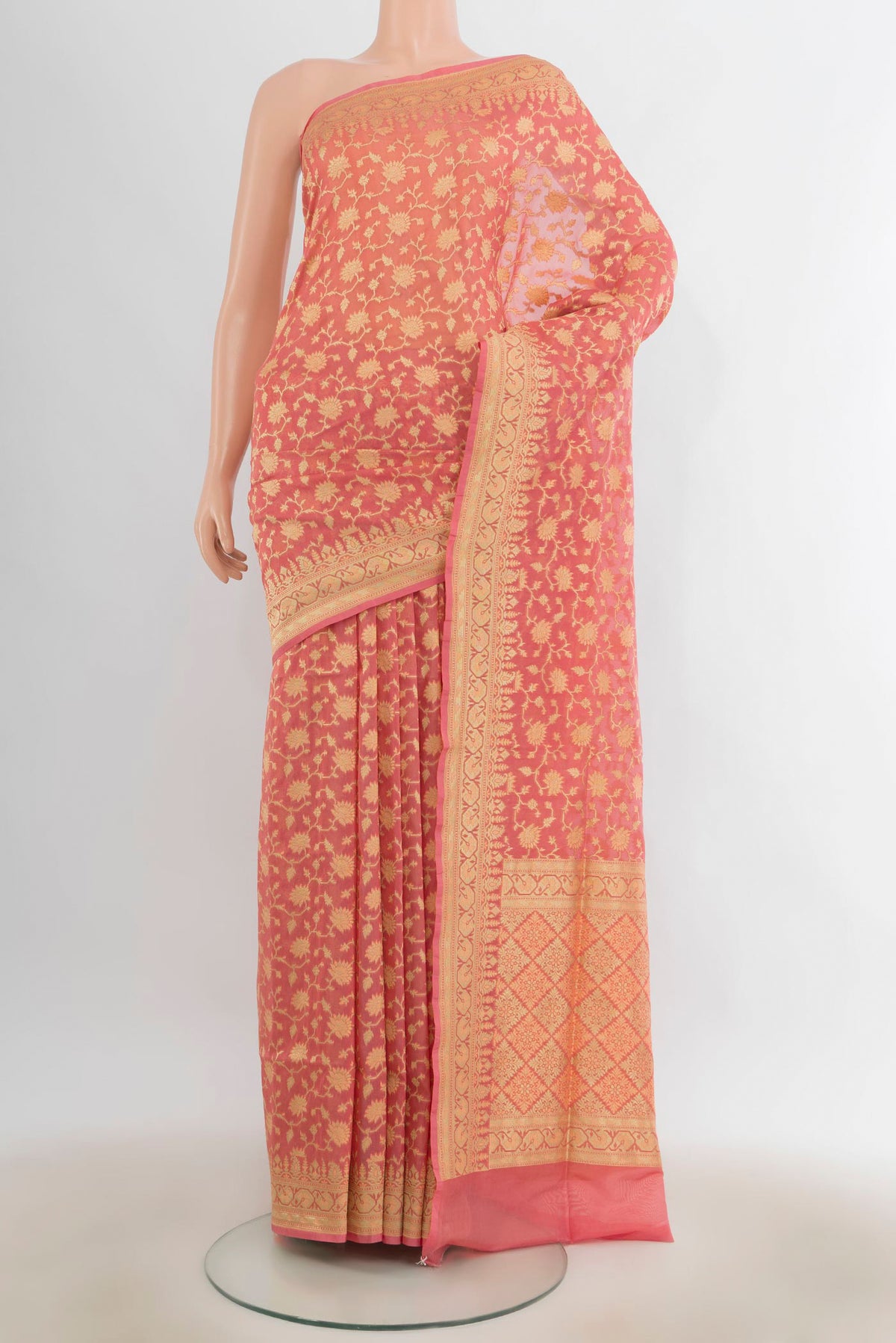 Pure Silk Peach Banarasi Saree with Zari Butta on the body and Zari Border.  displayed on a mannequin