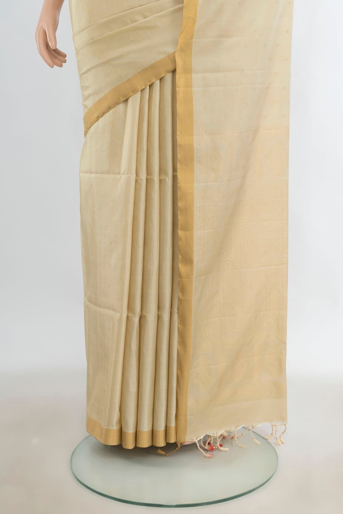 Pleats and pallu of Pure Silk Golden Soft Saree with Zari Butta on the body and Silk Border. 