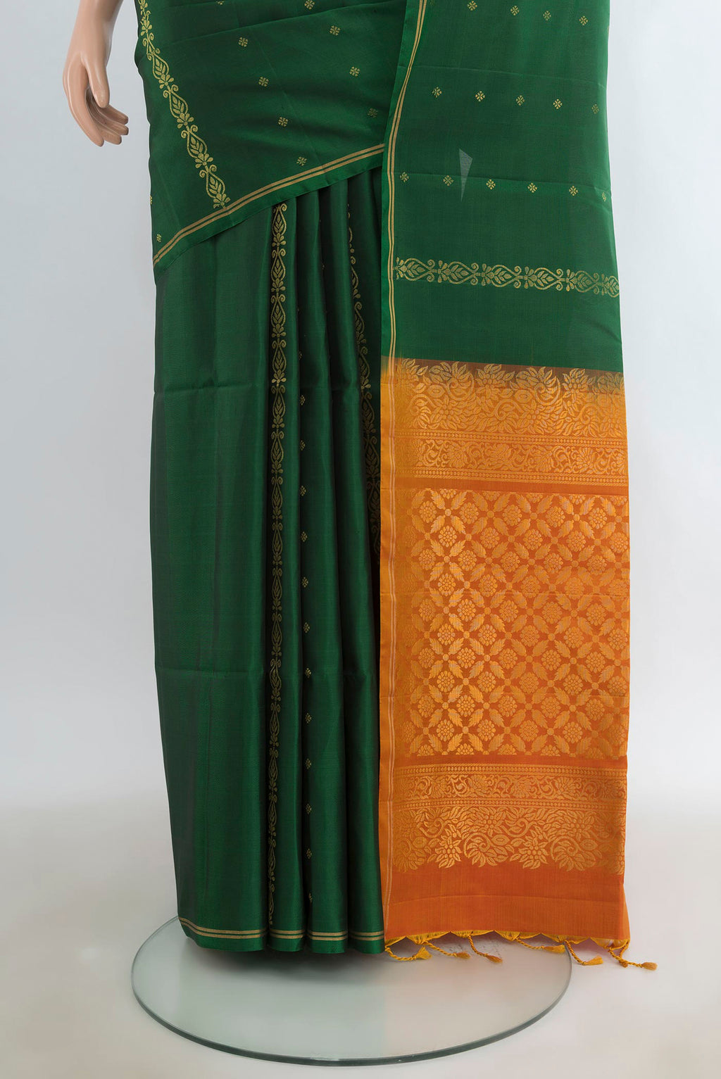 Pleats and pallu of Pure Silk Bottle Green Soft Saree with Zari Butta on the body and Zari Border. 