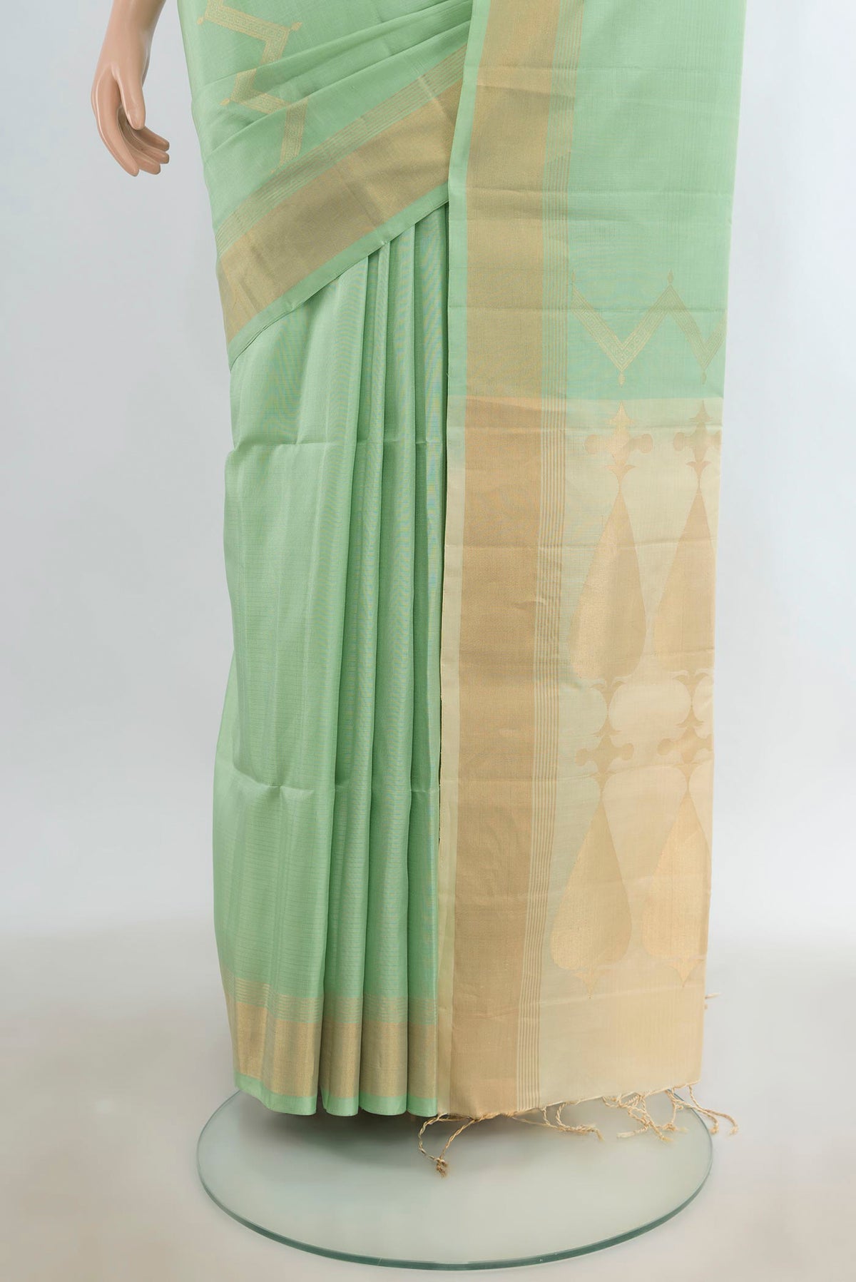 Pleats and pallu of Pure Silk Pista Green Soft Saree with Zari Butta on the body and Silk Border. 