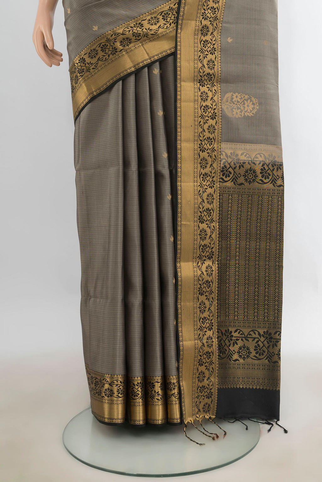 Pleats and pallu of Pure Silk Davys Grey Soft Saree with Zari Butta on the body and Zari Border. 