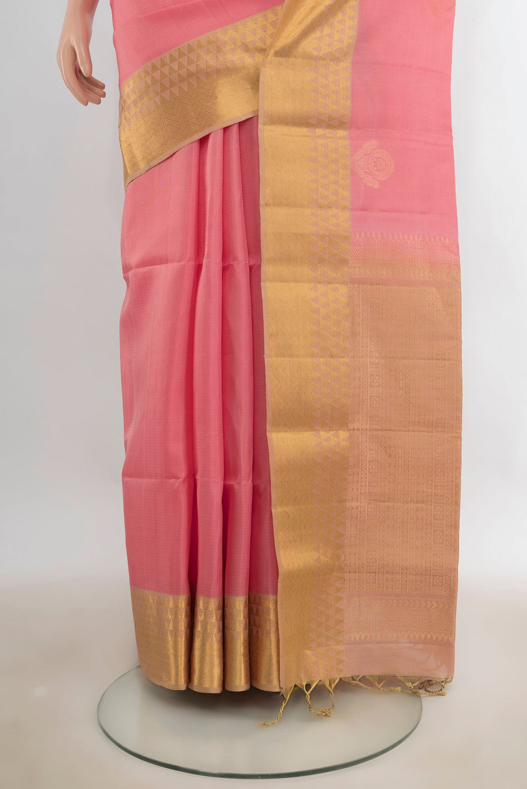 Pleats and pallu of Pure Silk Rose pink Soft Saree with Zari Butta on the body and Zari Border. 
