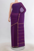 Violet Mysore Crepe Saree with Plain Body and Zari Border.  displayed on a mannequin