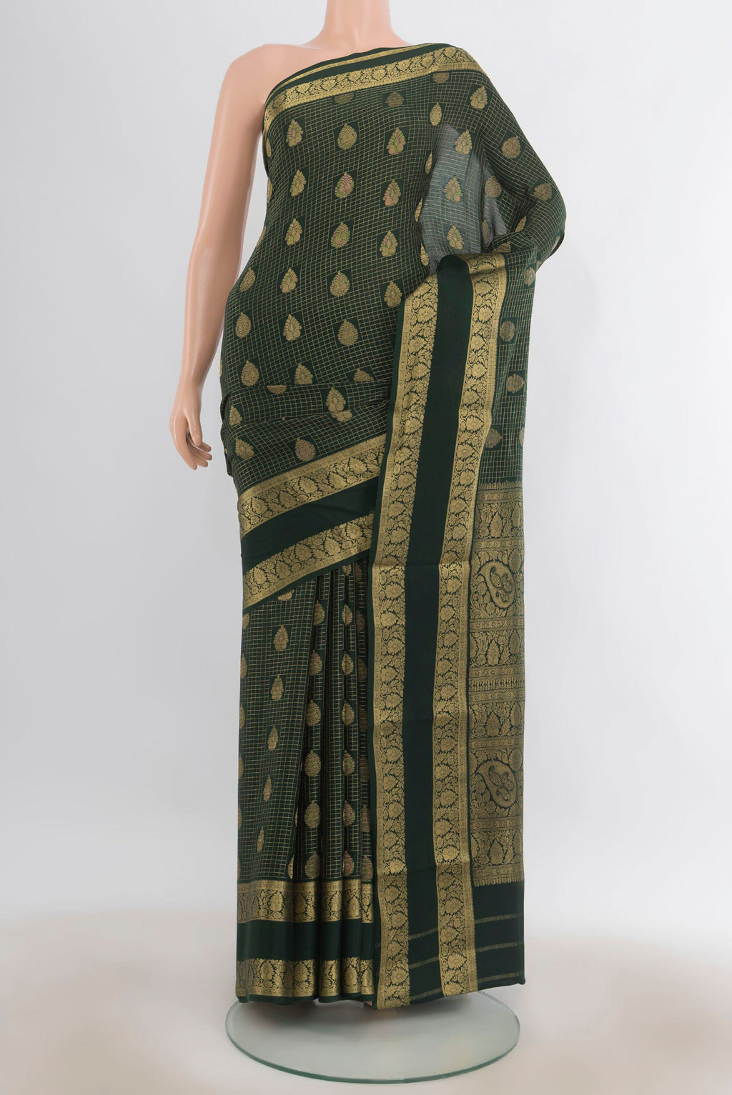 Bottle Green Mysore Crepe Saree with Checked design on the body and Zari Border.  displayed on a mannequin