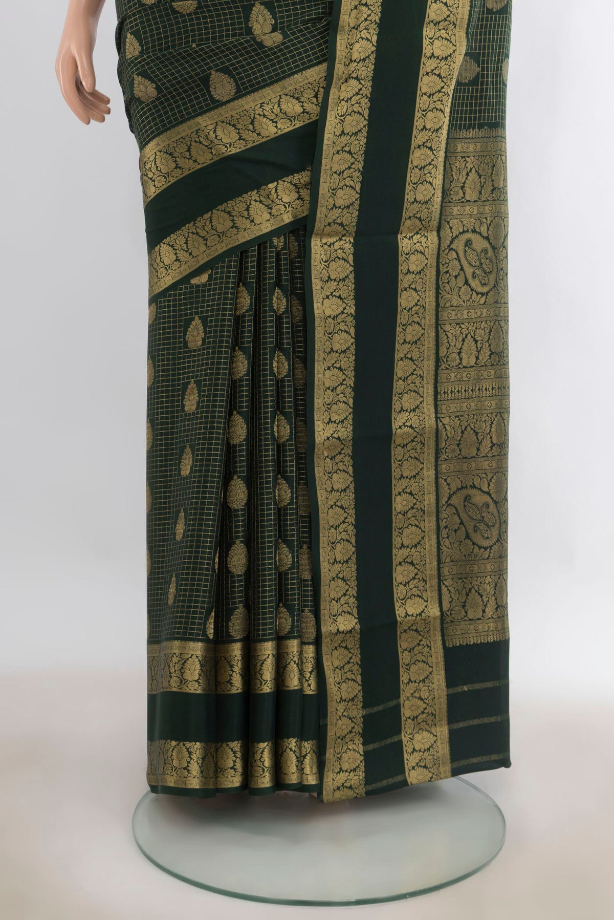 Pleats and pallu of Bottle Green Mysore Crepe Saree with Checked design on the body and Zari Border. 
