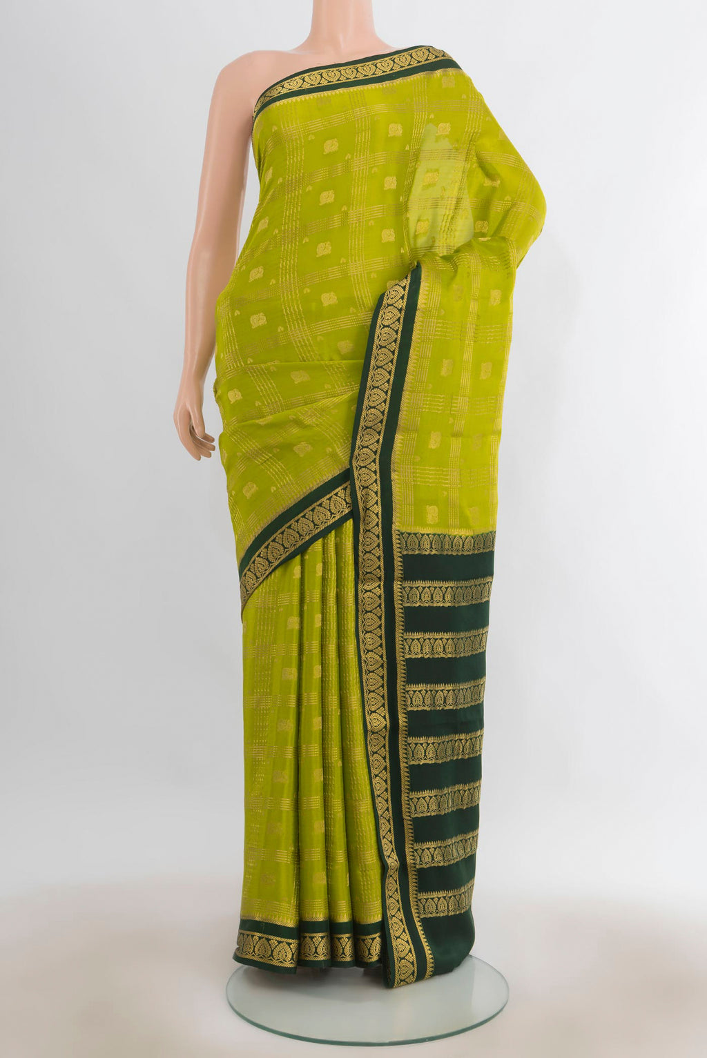 Light Green Mysore Crepe Saree with Zari Butta on the body and Silk Border.  displayed on a mannequin