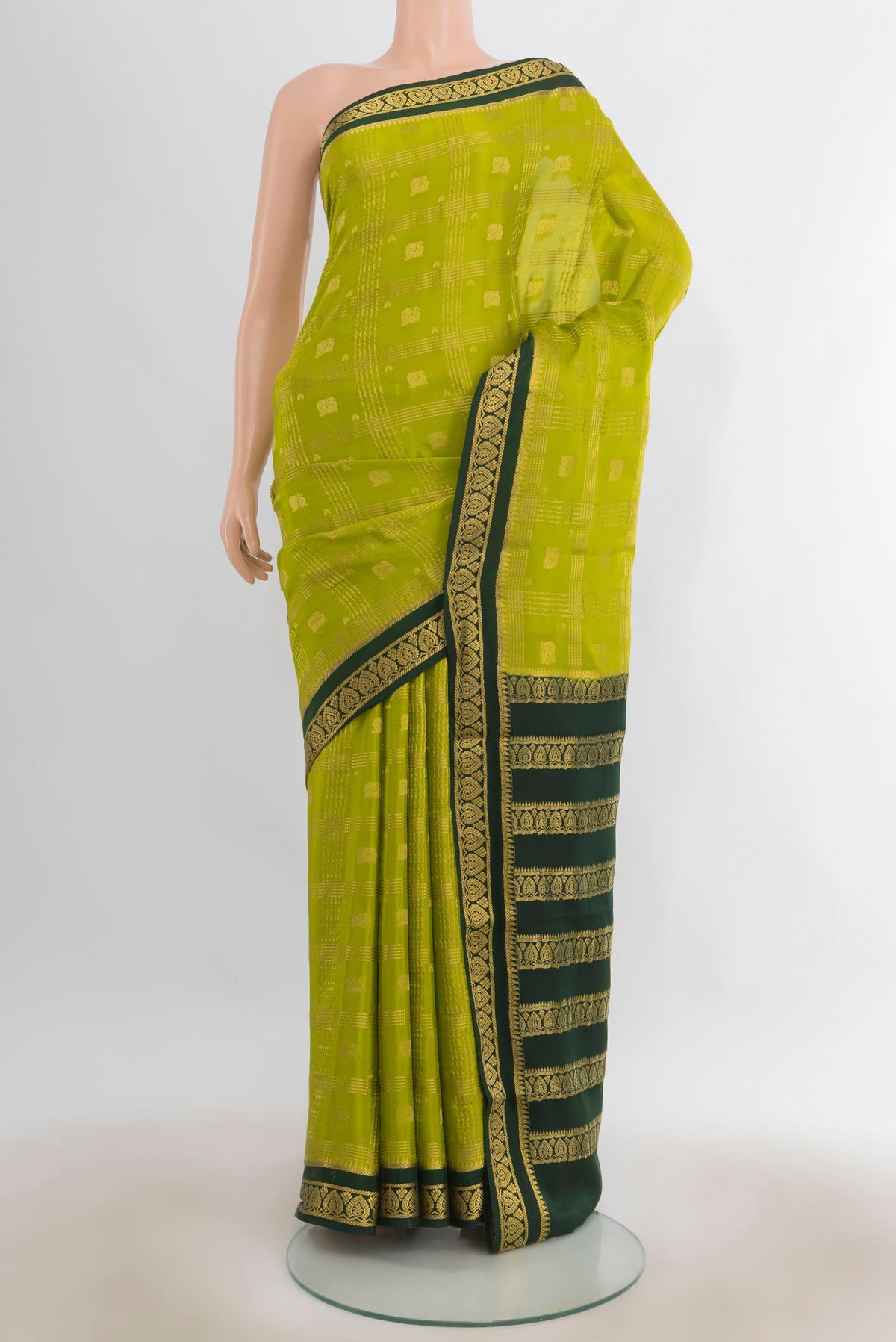 Light Green Mysore Crepe Saree with Zari Butta on the body and Silk Border.  displayed on a mannequin