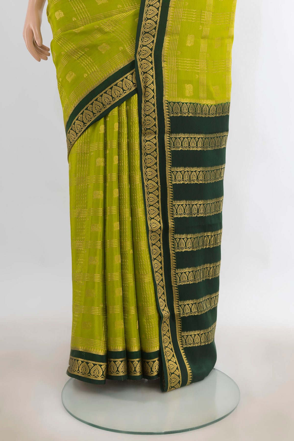 Pleats and pallu of Light Green Mysore Crepe Saree with Zari Butta on the body and Silk Border. 