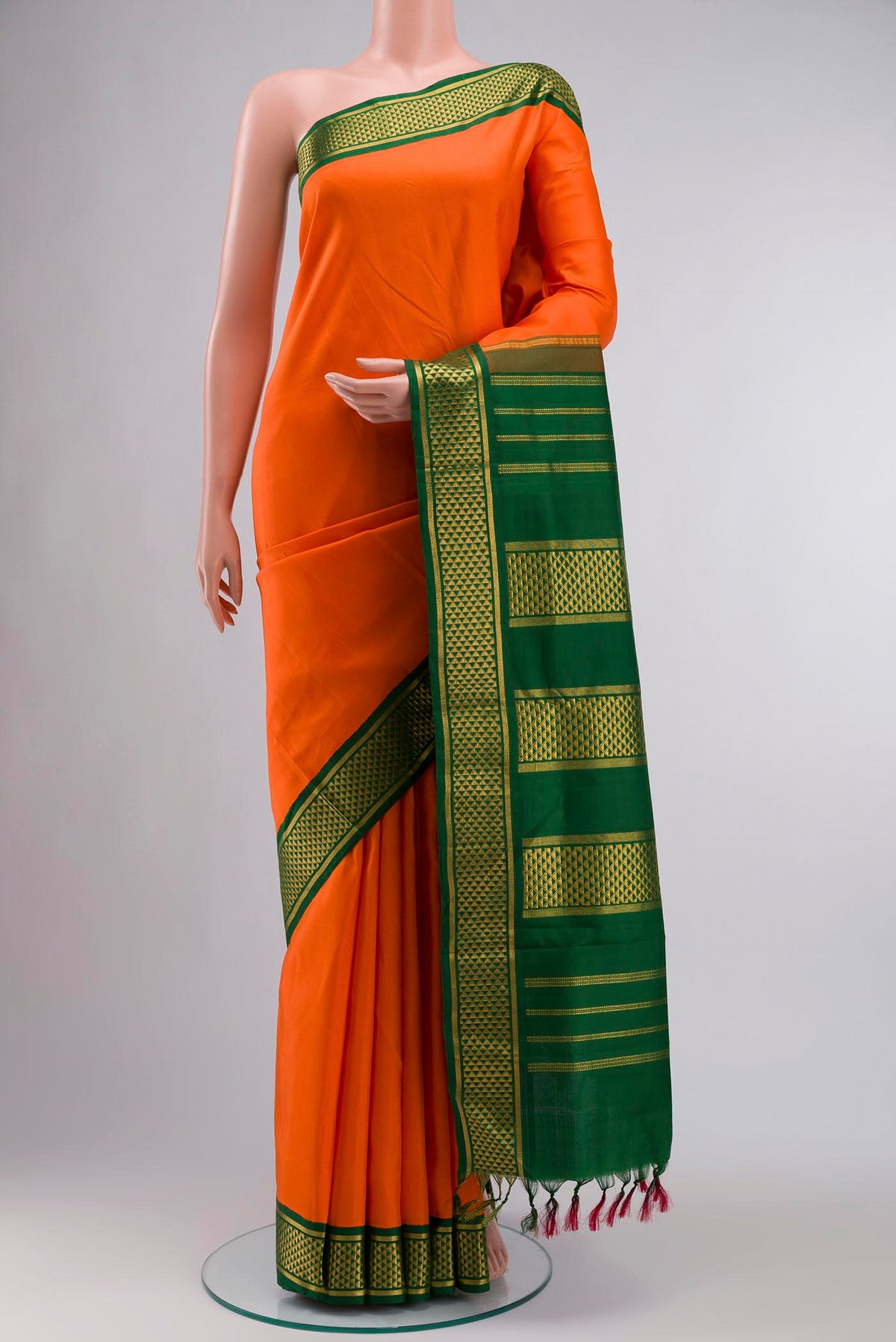 Orange Kanchipuram Silk Nine Yards Saree with Plain Body and Zari Border displayed on a mannequin