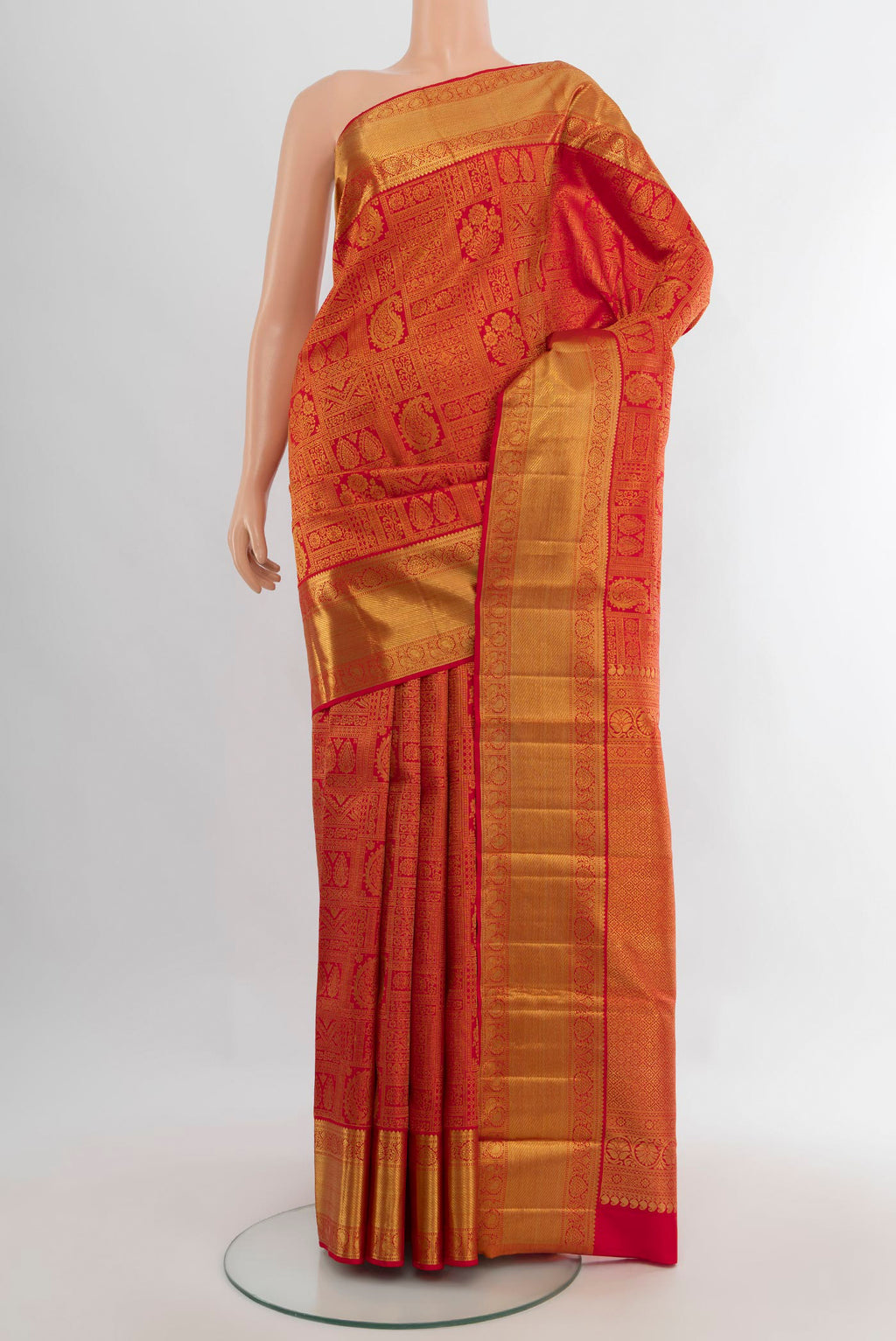 Pure Silk Pure Zari Red Kanjivaram Saree with Zari Brocade on the body and Zari Border.  displayed on a mannequin