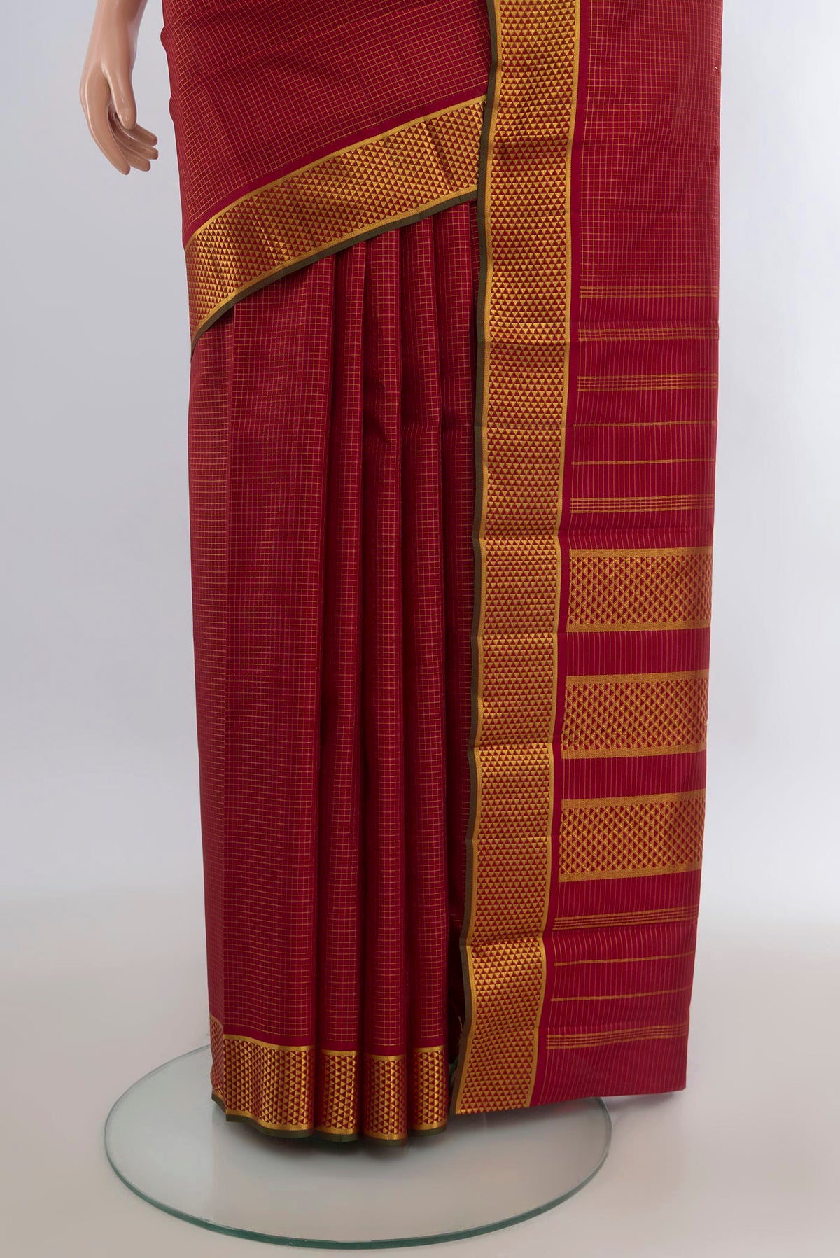 Pleats and pallu of Pure Silk Maroon Kanchipuram Saree with Checked design on the body and Zari Border. 