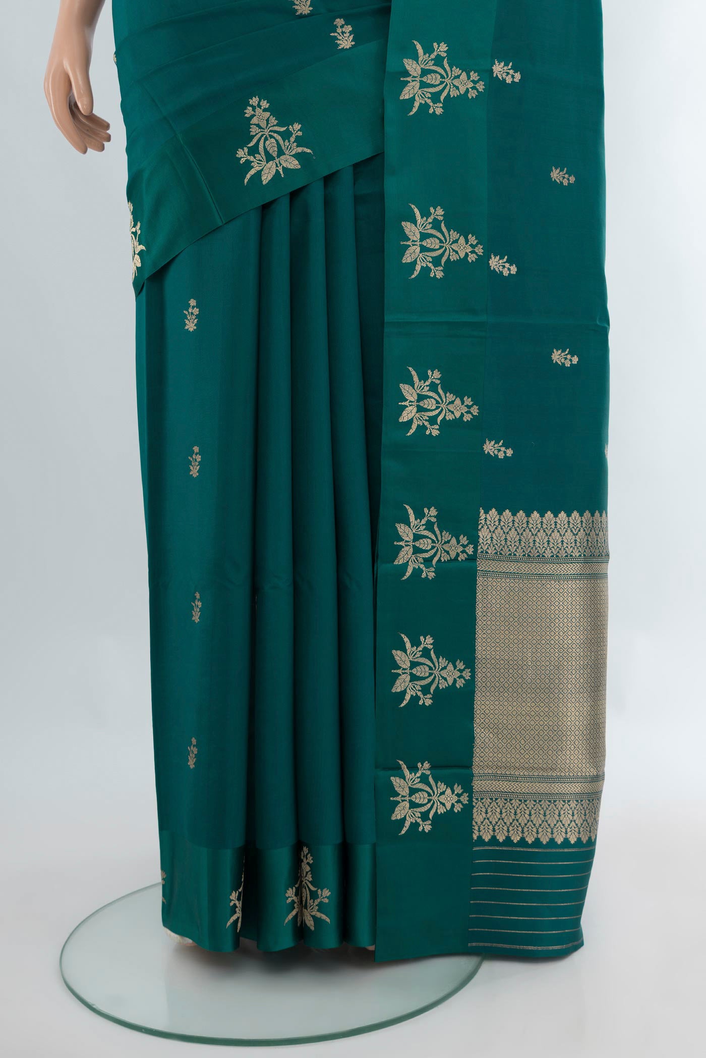 Pleats and pallu of Peacock Blue Banarasi Katan Silk Saree with Zari Butta on the body and Satin Border. 