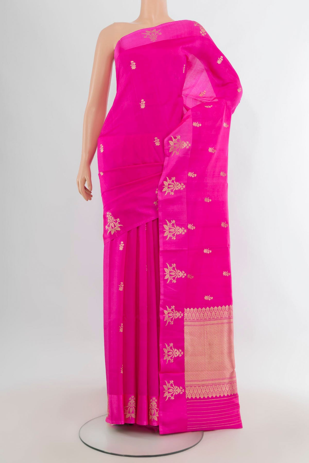 Pure Silk Rani Pink Banarasi Katan Saree with Zari Butta on the body and Satin Border.  displayed on a mannequin
