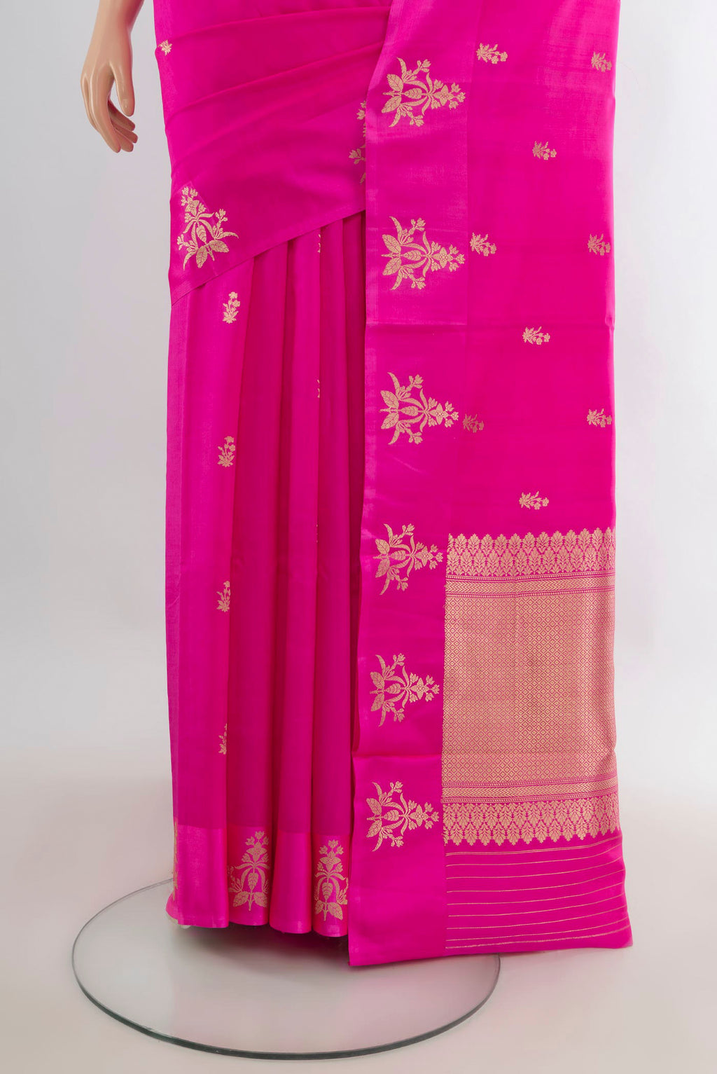 Pleats and pallu of Pure Silk Rani Pink Banarasi Katan Saree with Zari Butta on the body and Satin Border. 