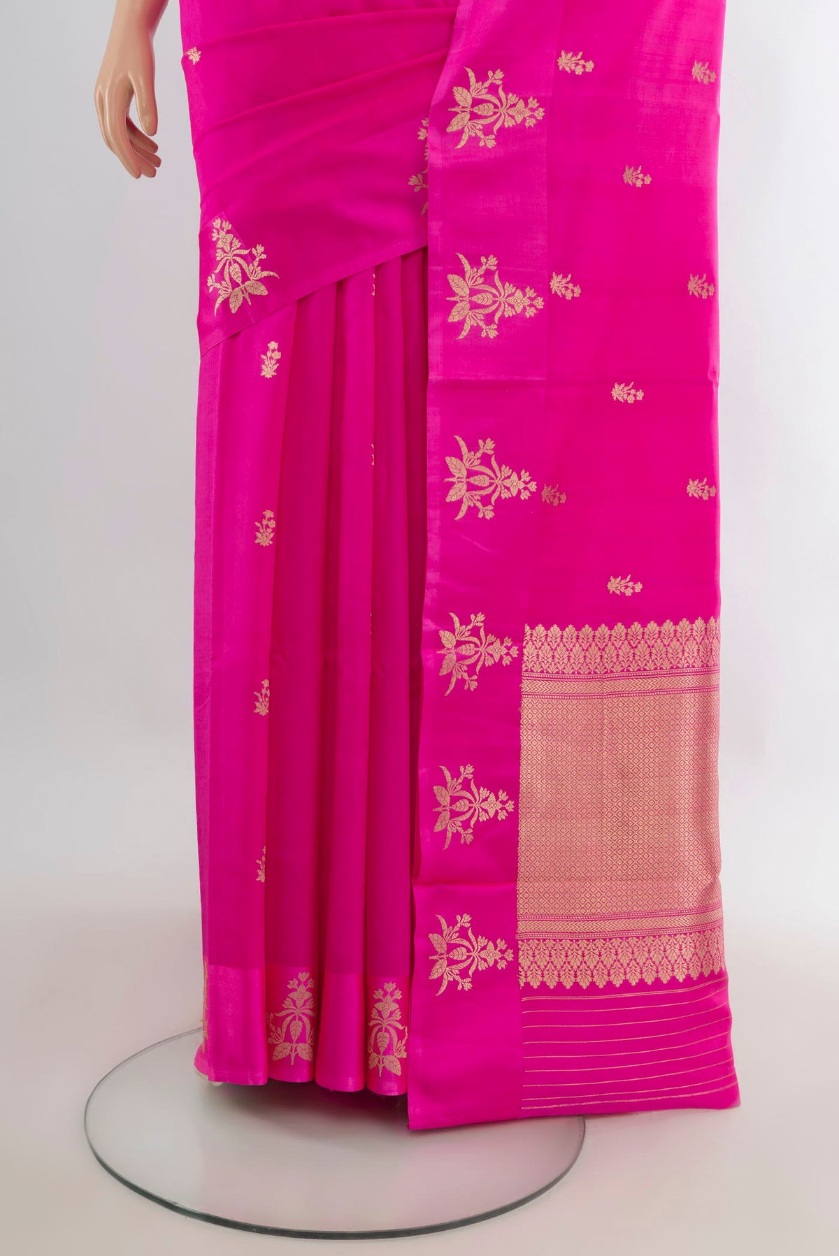 Pleats and pallu of Pure Silk Rani Pink Banarasi Katan Saree with Zari Butta on the body and Satin Border. 