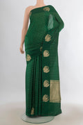 Pure Silk Bottle Green Banarasi Katan Saree with Checked design on the body and Plain Border.  displayed on a mannequin