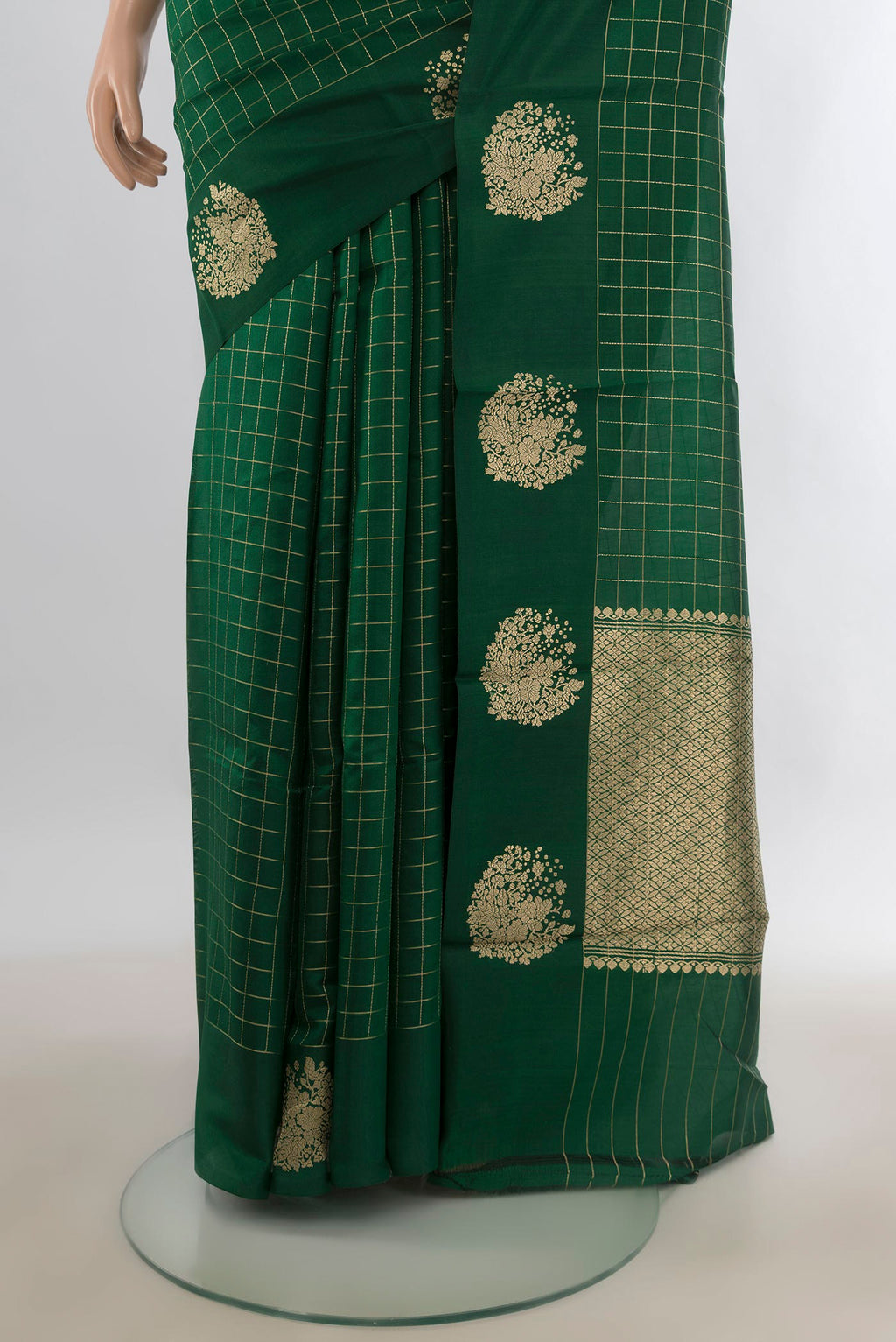 Pleats and pallu of Pure Silk Bottle Green Banarasi Katan Saree with Checked design on the body and Plain Border. 