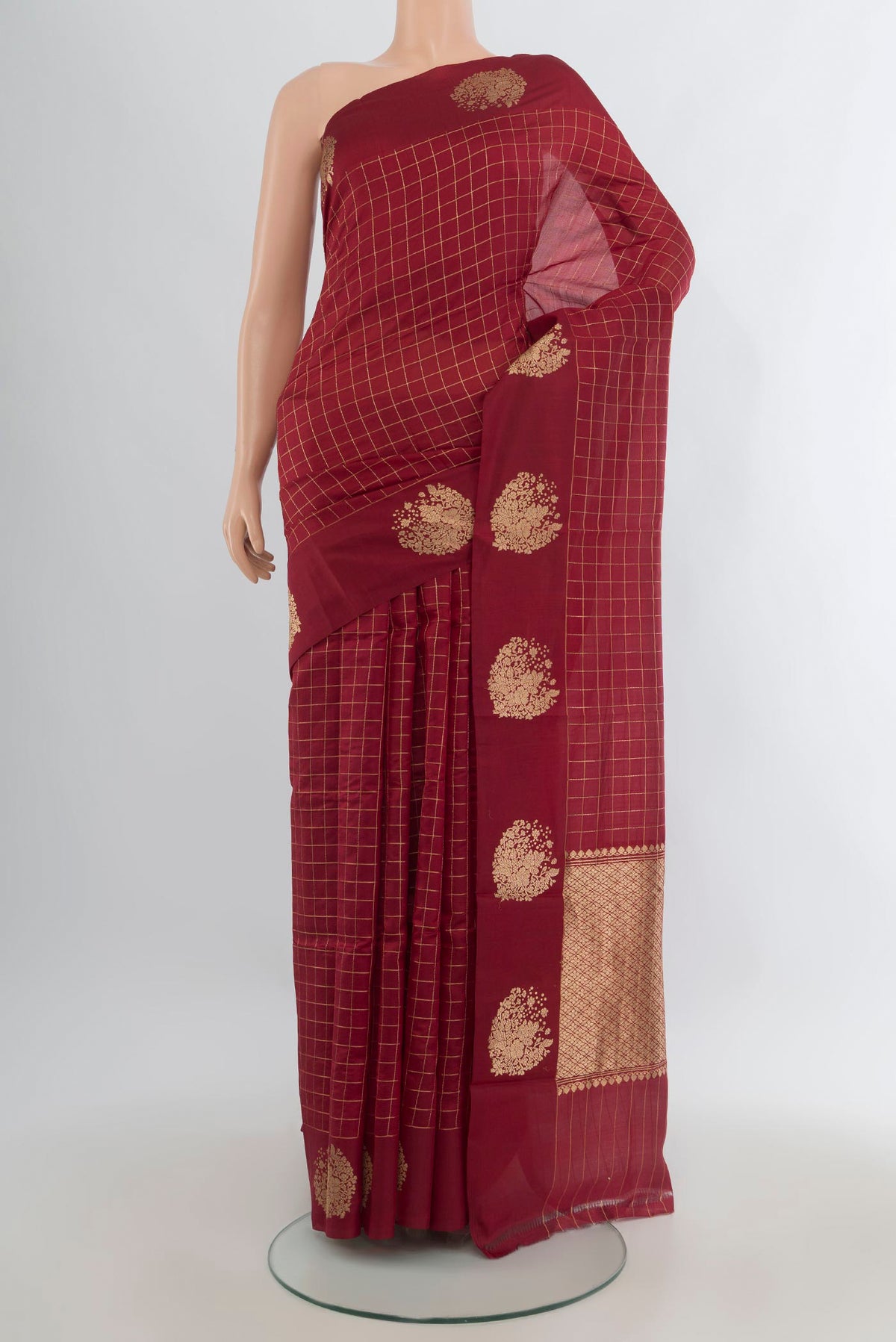Pure Silk Maroon Banarasi Katan Saree with Stripes on the body and Zari Border.  displayed on a mannequin