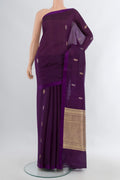 Violet Banarasi Katan Silk Saree with Zari Butta on the body and Plain Border.  displayed on a mannequin