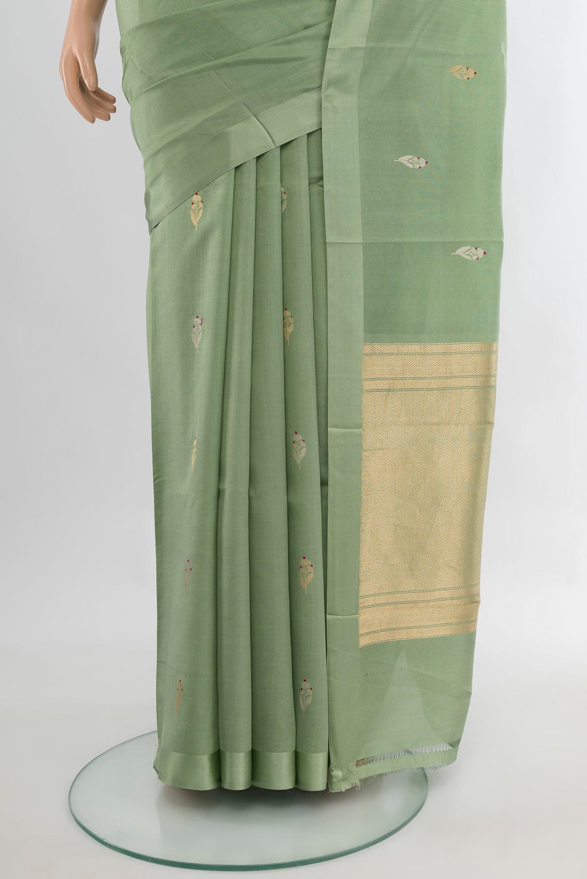 Pleats and pallu of Pure Silk Pista Green Banarasi Katan Saree with Zari Butta on the body and Plain Border. 
