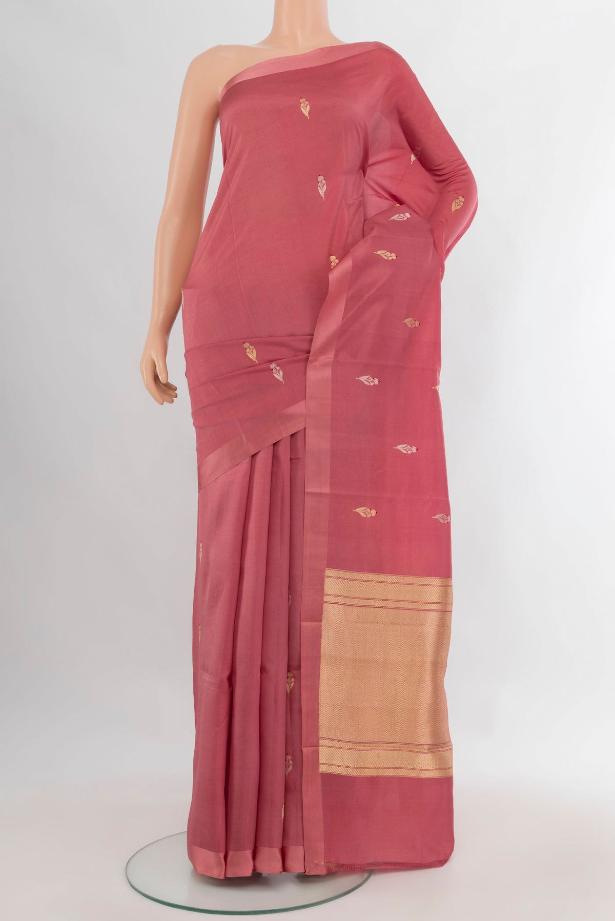 Pure Silk Rose Gold Banarasi Katan Saree with Zari Butta on the body and Plain Border.  displayed on a mannequin